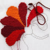 Flower - reds being stitched